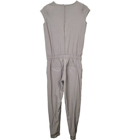 Albion Fit Jumpsuit XS Beige Stretch Cap Sleeve Cinch Waist Ankle‎ Zip One Piece - Picture 2 of 8